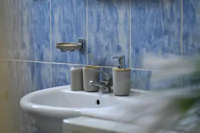 a bathroom with a sink with two cups on it at Perfect Location close to Jaz beach - Apartments Rora Knezevic in Budva