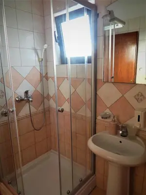 a bathroom with a shower and a sink at Vila Teodora in Sveti Stefan
