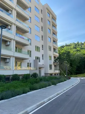 an empty street in front of a building at Comfort studio with sea view and swimming pool in Becici