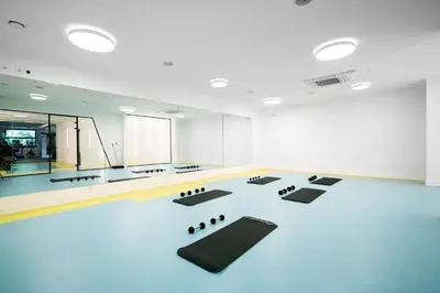 a room with a dance floor with black mats at Comfort studio with sea view and swimming pool in Becici