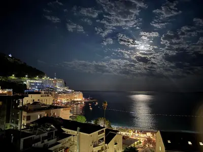 a view of the ocean at night at Front Row Sunset in Rafailovici