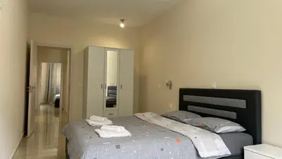 a bedroom with a bed with towels on it at Apartments Seaview Estate Radovic in Kotor