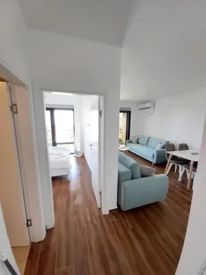 a living room with a couch and a table at Apartmani Aida in Dobra Voda