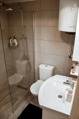 a bathroom with a toilet and a shower and a sink at Sojenica Ivona in Ulcinj