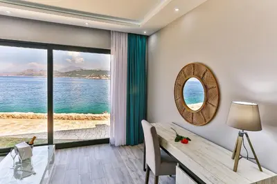 a dining room with a view of the ocean at Dulamerovic Resort in Bar