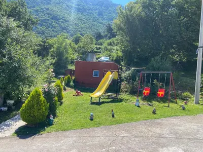 a yard with a playground with a slide at Apartment Lorena in Kotor