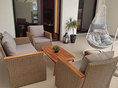a living room with chairs and a hammock at Accordion Apartment in Bar