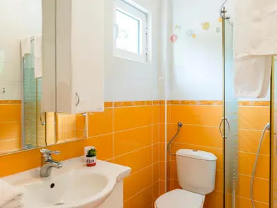 a bathroom with a toilet and a sink at Green Home Apartments in Kotor