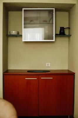 a kitchen with a cabinet and a counter top at Villa Casa di Pietra - Budva Old town in Budva