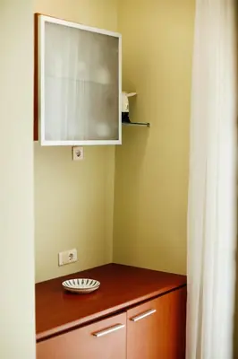 a kitchen with a cabinet and a wooden counter top at Villa Casa di Pietra - Budva Old town in Budva