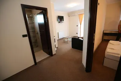 a room with a door leading to a room with a bathroom at VilaElenaMarko in Budva