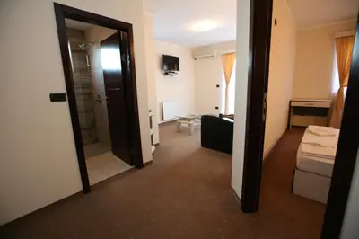 a room with a door leading to a room with a bathroom at VilaElenaMarko in Budva