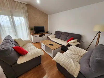 a living room with two couches and a television at Apartment Dukić in Bar