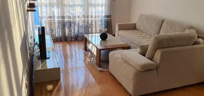 a living room with a couch and a table at Elena in Bar