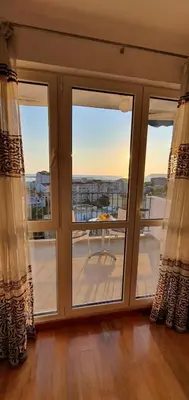 a room with a window with a view of a balcony at Elena in Bar