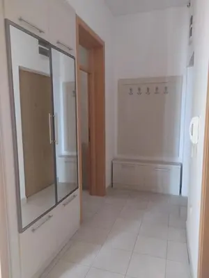 a bathroom with a mirror and a white tile floor at Elena in Bar