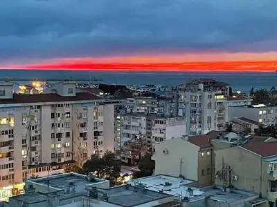 a view of a city at sunset with buildings at Elena in Bar