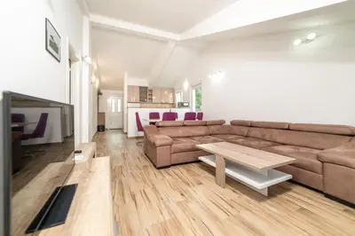 a living room with a couch and a table at Apartments Budva Center 2 in Budva