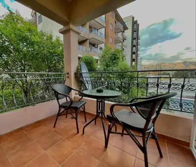 a balcony with a table and chairs on a balcony at Apartments Petkovic Budva in Budva