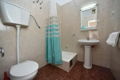 a bathroom with a toilet and a sink at Apartmani Soljaga in Petrovac na Moru