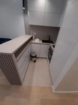 a small kitchen with a counter and a sink at Rent apartment lux soho city Bar in Bar