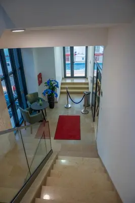 a hallway with a red rug and a red carpet at Premium Berlin with Pool in Ulcinj