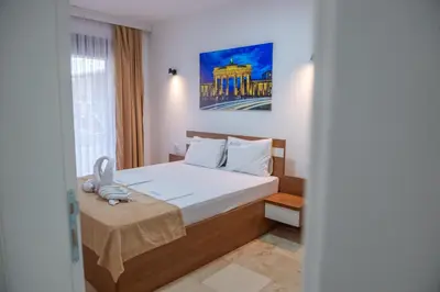 a hotel room with a bed and a window at Premium Berlin with Pool in Ulcinj