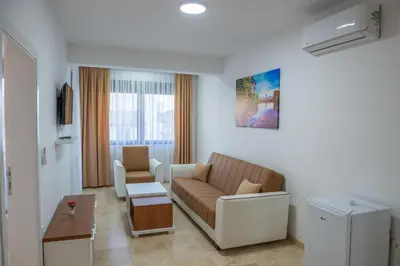 a living room with a couch and a table at Premium Berlin with Pool in Ulcinj