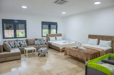 a living room with two beds and a couch at Premium Berlin with Pool in Ulcinj