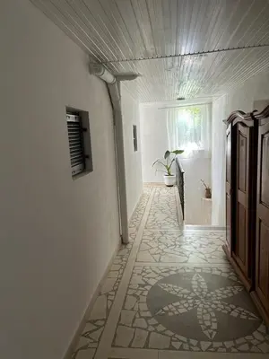 a hallway with a room with a tile floor at Apartments Doda in Ulcinj