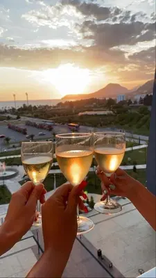 a group of people holding up glasses of wine at Luxury Apartment Sea View Soho City 5th floor in Bar