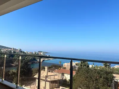a view of the ocean from a balcony at White Star Apartments in Utjeha
