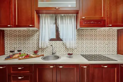 a kitchen counter with a sink and a window at Apartment Aura with Sea View in Kotor