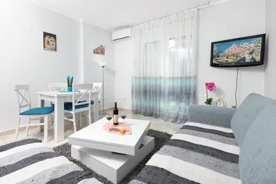 a living room with a couch and a table at Apartment Milos in Kotor