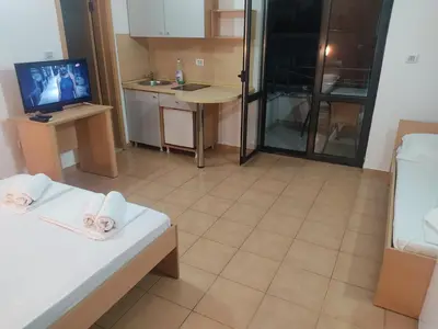 a room with a kitchen and a living room at Apartments Mare Budva in Budva