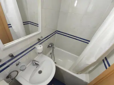 a bathroom with a sink and a toilet and a tub at Apartments Mare Budva in Budva