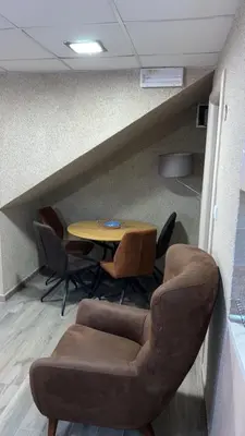 a meeting room with a table and chairs at Ribnica in Podgorica