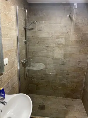 a bathroom with a shower and a sink at Ribnica in Podgorica