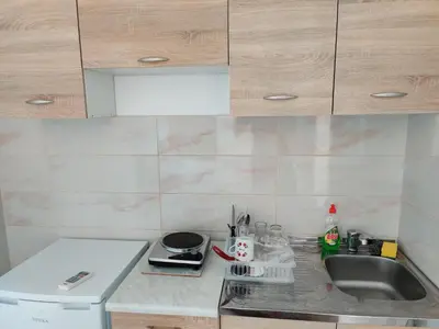 a kitchen with a sink and a counter top at Apartments BEA in Ulcinj