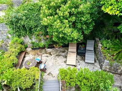 an overhead view of a garden with benches and trees at HealthyStudio512 Apartments in Kotor