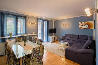 a living room with a couch and a table at Apartman AS in Budva