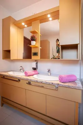 a bathroom with two sinks and a mirror at Villa Katarina in Budva
