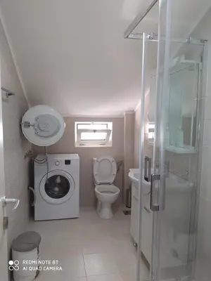a small bathroom with a toilet and a sink at Apartman Andjela in Kavač