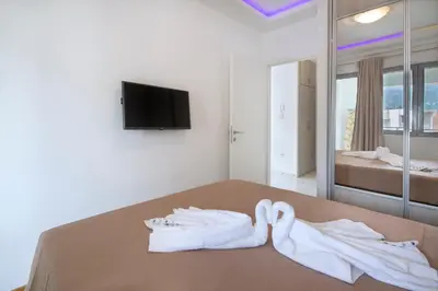 a room with two white towels on a table at City center lux apartment in Budva