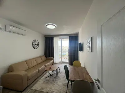 a living room with a couch and a table at Apartments San with Sea View in Dobra Voda
