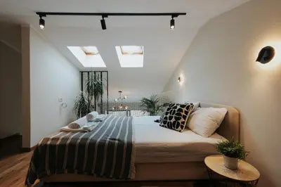 a bedroom with a bed with a striped blanket at The View apartment in Petrovac na Moru