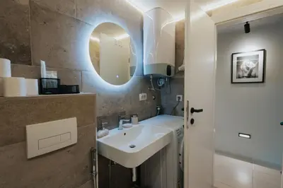 a bathroom with a sink and a mirror at The View apartment in Petrovac na Moru