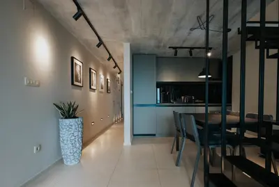 a dining room and kitchen with a table and chairs at The View apartment in Petrovac na Moru