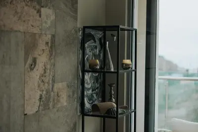 a shelf with some items on it in a bathroom at The View apartment in Petrovac na Moru