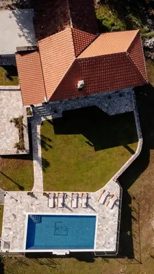 an overhead view of a building with a swimming pool at Etno Villa Mokanji in Danilovgrad